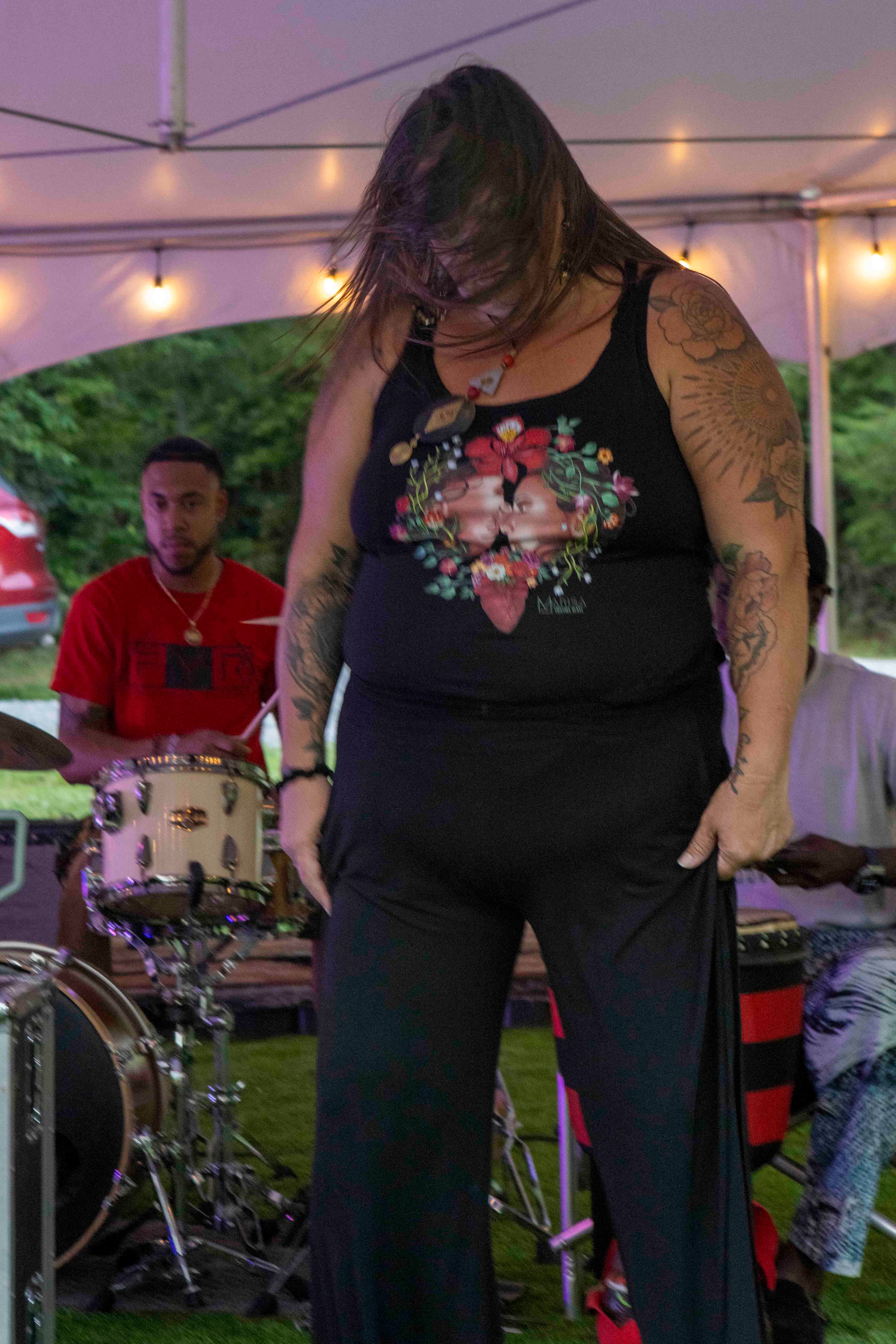 Vocalist performing under tent, Wonder Weekend 2025
