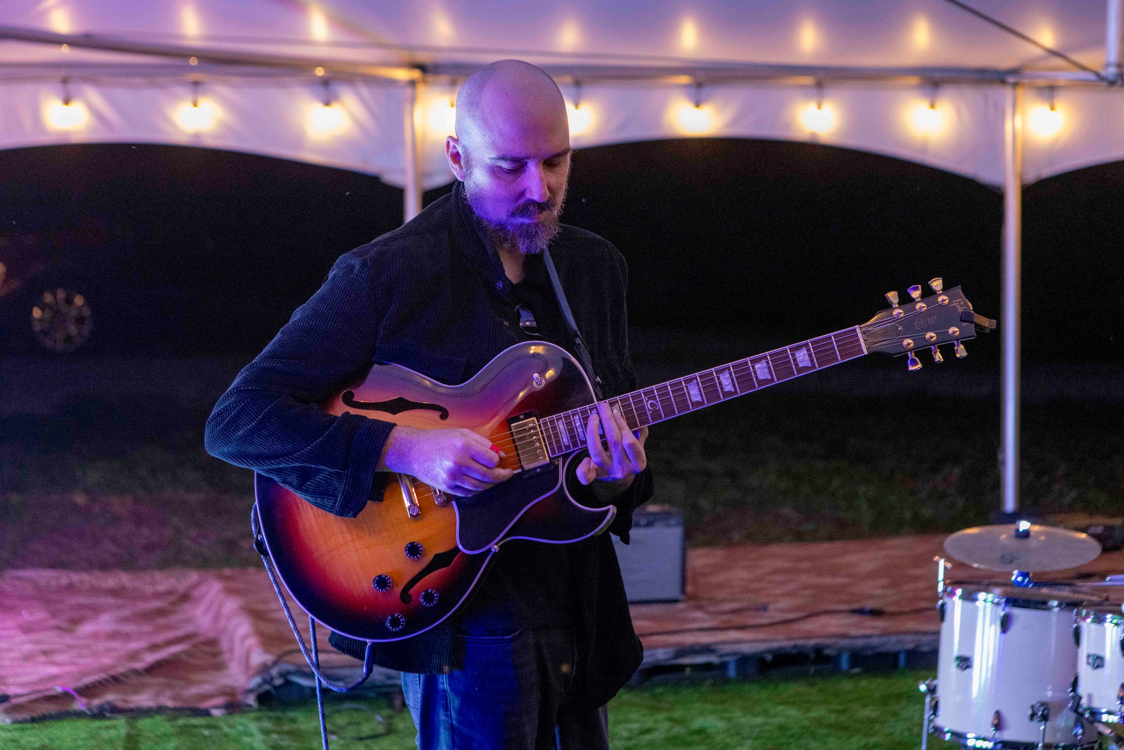 Guitarist performing under purple stage lights, Wonder Weekend 2025