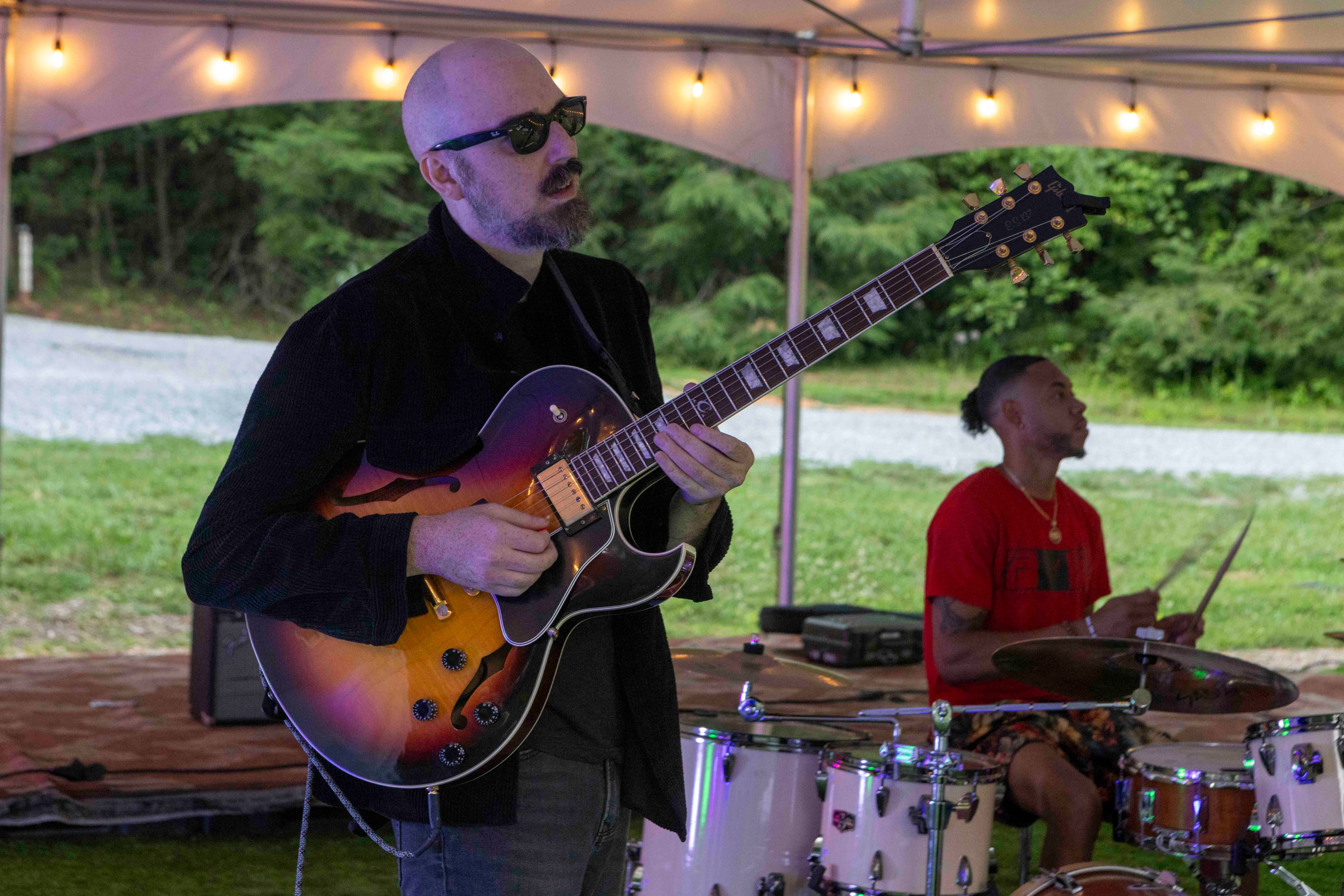 Guitarist and drummer performing at night, Wonder Weekend 2025